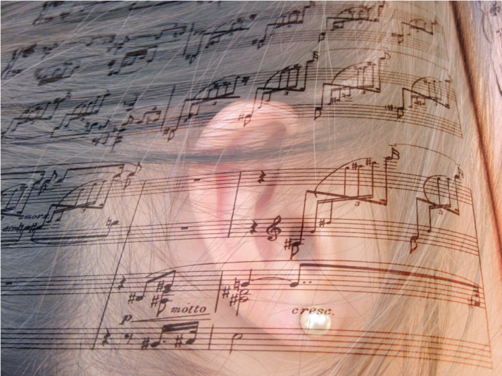 design associating a sheet music and the ear of a woman, in a web page related to music research, music technology and the YMusic search engine