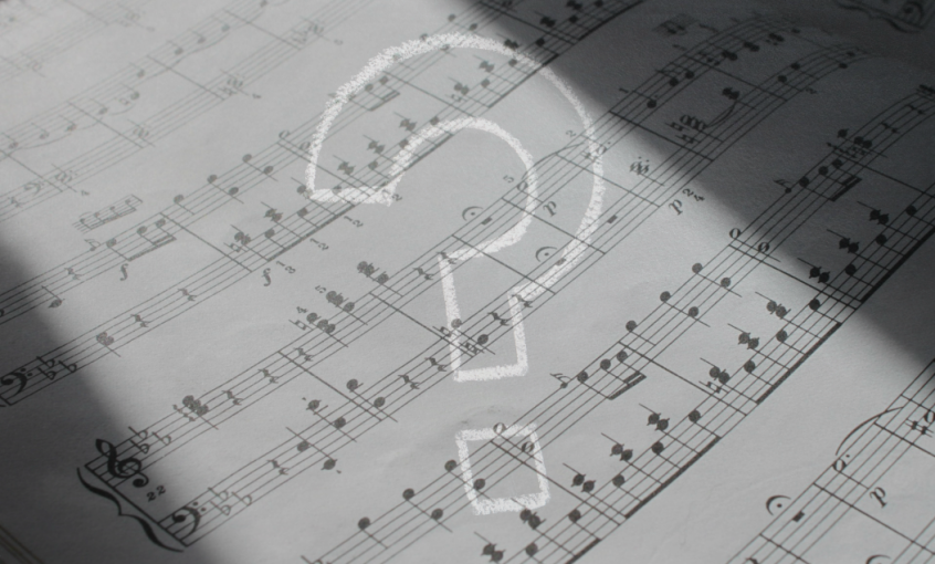 design associating a sheet music and a question mark, in a web page related to music research, music technology and the YMusic search engine