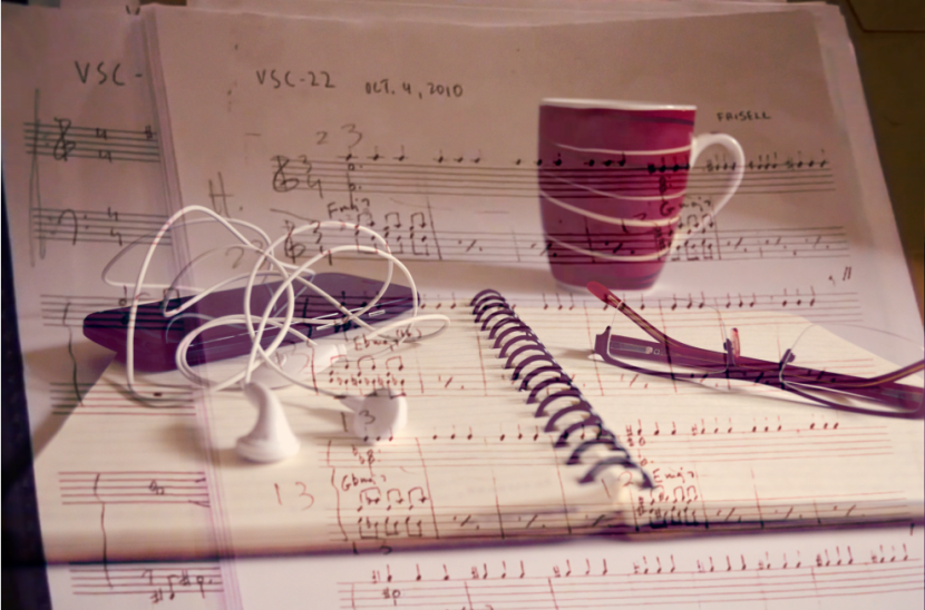 design associating earphones and a sheet music, in a web page related to music research, music technology and the YMusic search engine