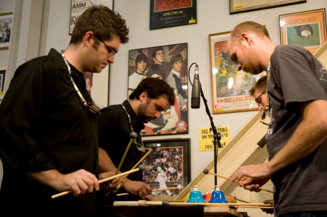 image presenting percussion players, in a web page related to music research, music technology and the YMusic search engine